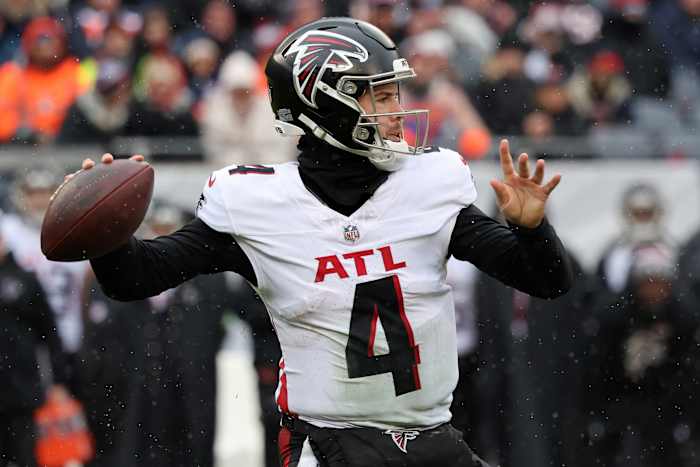 Dec 31, 2023; Chicago, Illinois, USA; Atlanta Falcons quarterback Taylor Heinicke (4) drops back to pass against the Chicago Bears during the first half at Soldier Field.